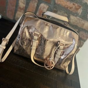 Michael Kors rose gold metallic bag.